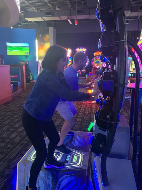 Sade (bvoip) and Andrew (ThreatLocker) playing arcade games